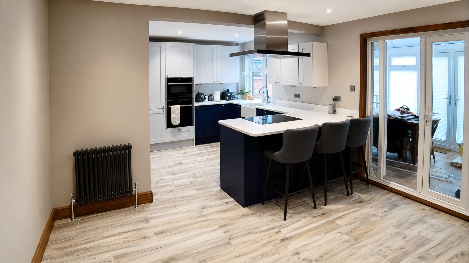 Completed open-plan kitchen and living area following load-bearing wall removal in Deptford, London
