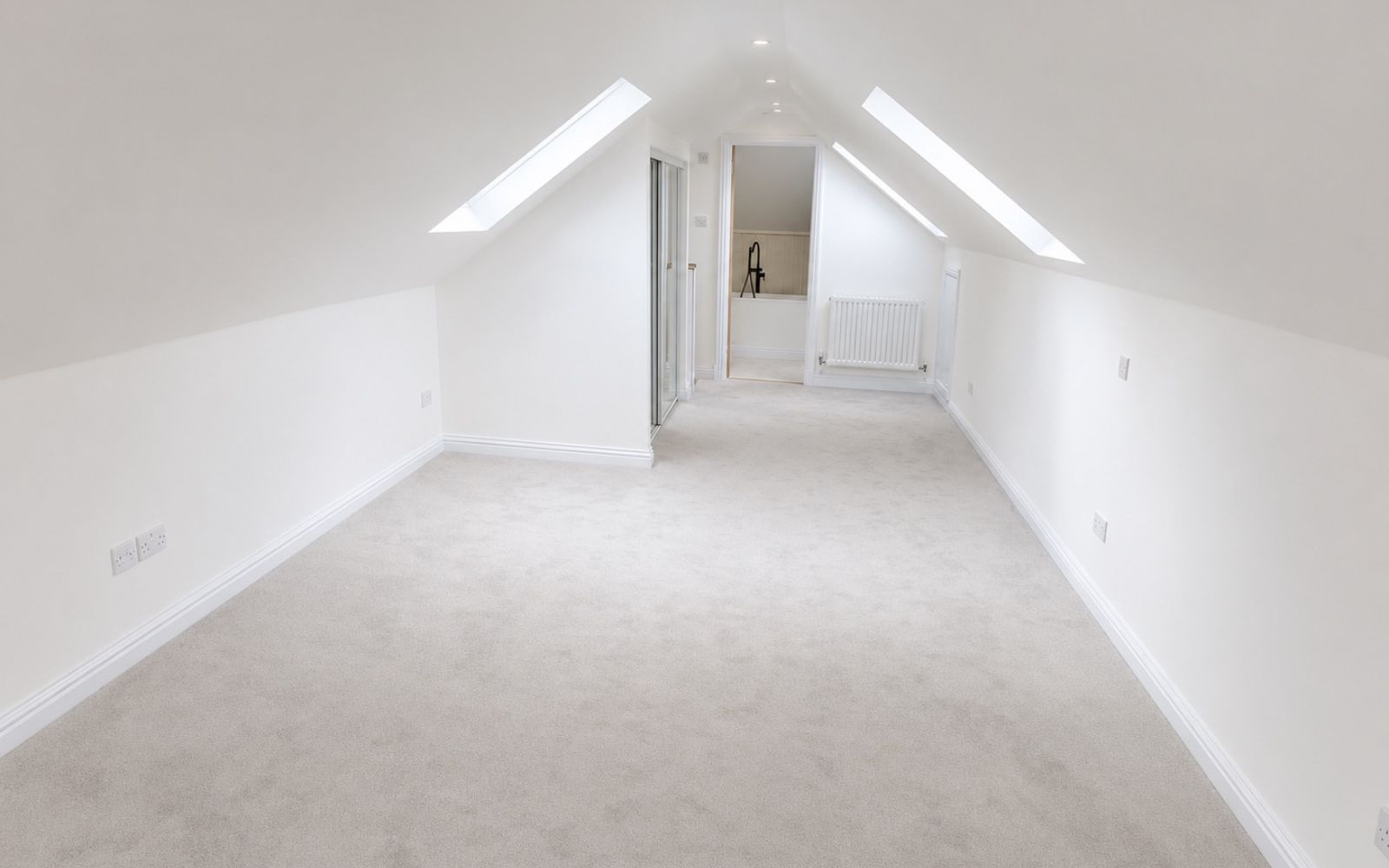 Completed loft bedroom in Barnet bungalow conversion